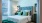 a bedroom with a bed and a lamp