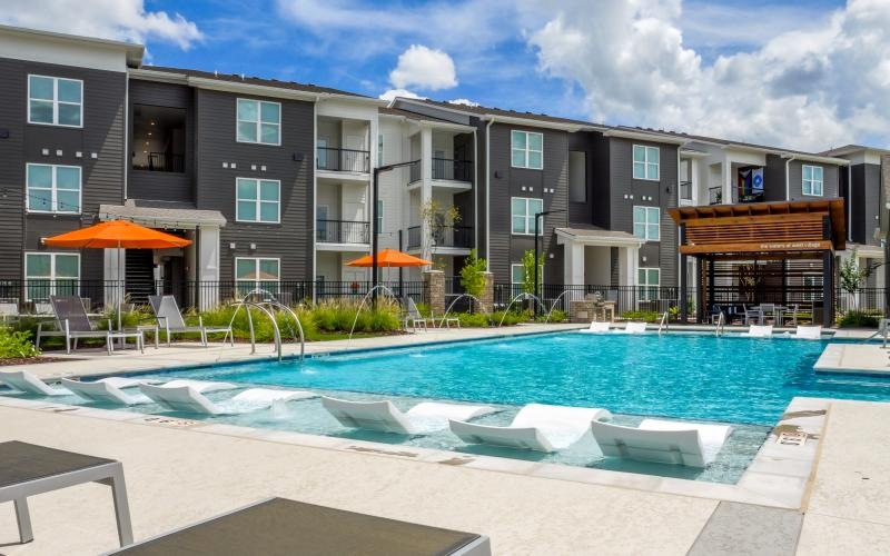a swimming pool in front of a building