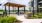 a covered patio with a seating area