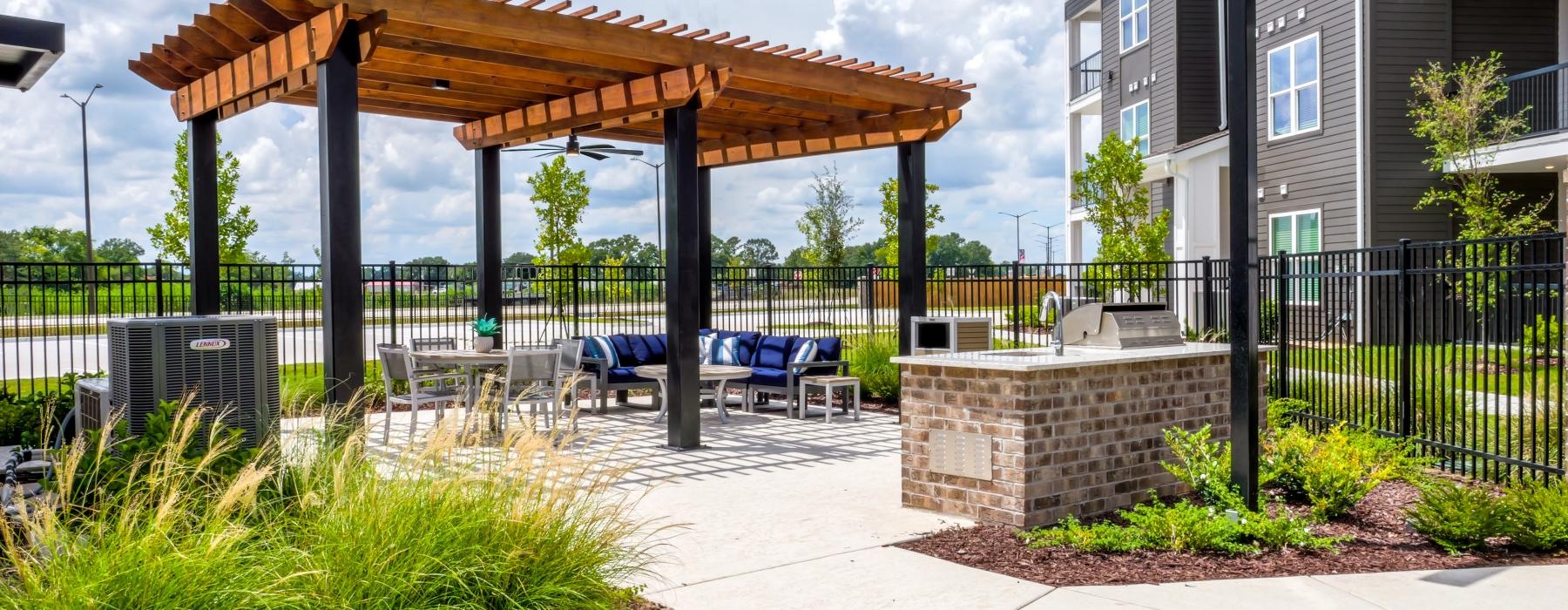 a covered patio with a seating area