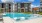 a swimming pool in front of a building