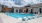 a swimming pool in front of a house