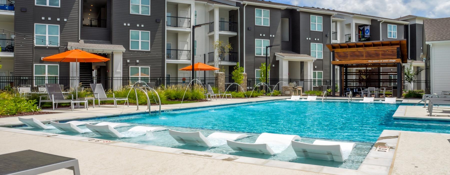 a swimming pool in front of a building