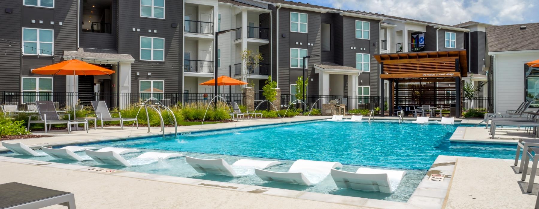 a swimming pool in front of a building