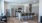 a kitchen with bar stools and an island