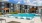 a swimming pool in front of a building