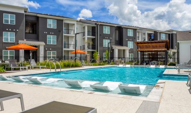a swimming pool in front of a building