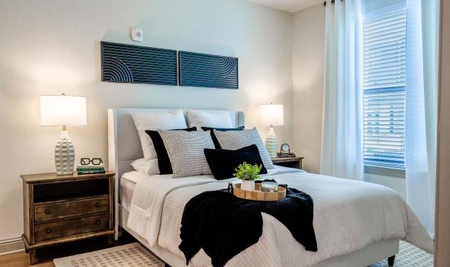 a bed with a black blanket